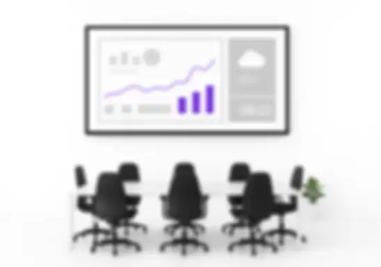 Office team discusses strategy while KPIs and company updates are displayed on a screen
